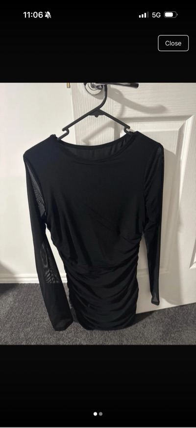Black long sleeve top with sheer sleeves and ruching