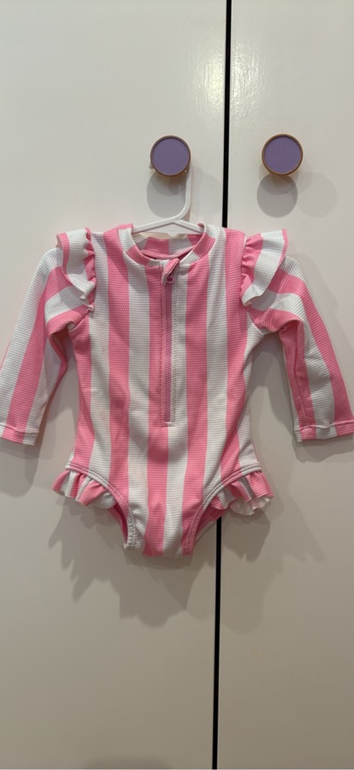 Pink and white striped baby swimsuit