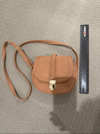 Brown braided crossbody bag with gold-tone clasp