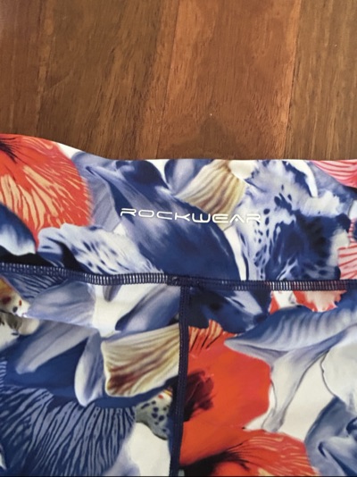 NEW Rockwear blue, red, and white floral leggings with diagonal stripes on the l